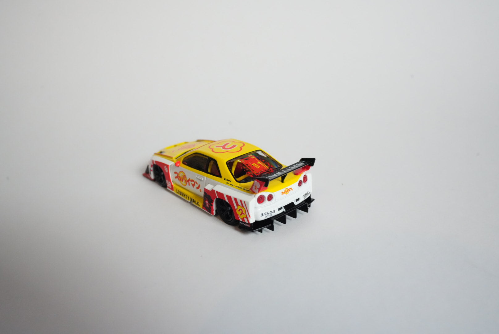 MINI GT #1204 Nissan LB-ER34 Super Silhouette SKYLINE – Suppaiman Okinawa – 1:64